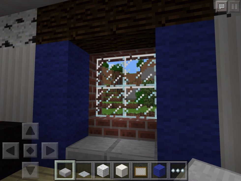 Now this is nice! A little window seat! The blue wool acts as curtains to bring more colour to the room.