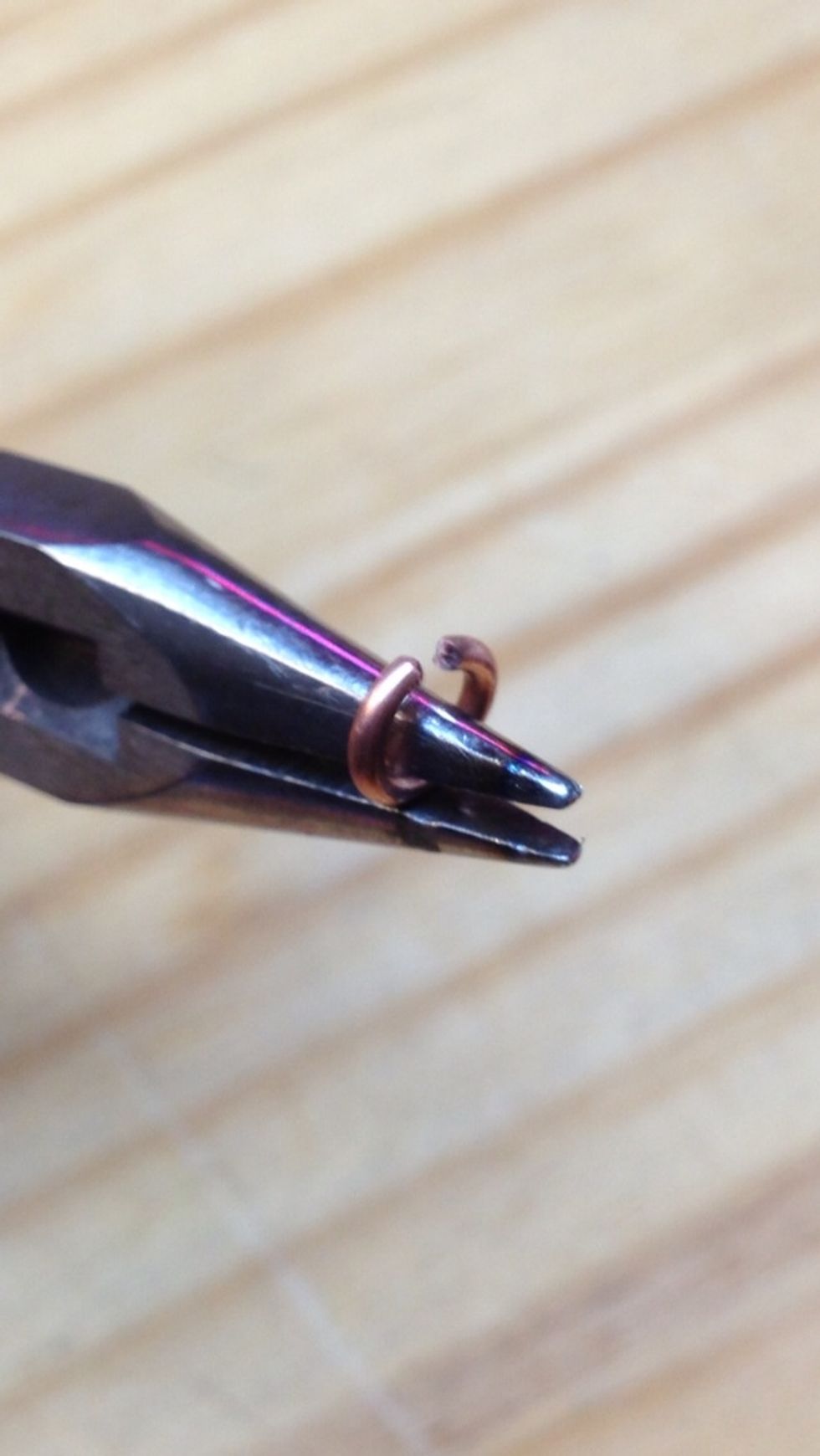 Now, this is the hardest part. Splay each ring just enough to fit it over the end of a 12 gauge segment.