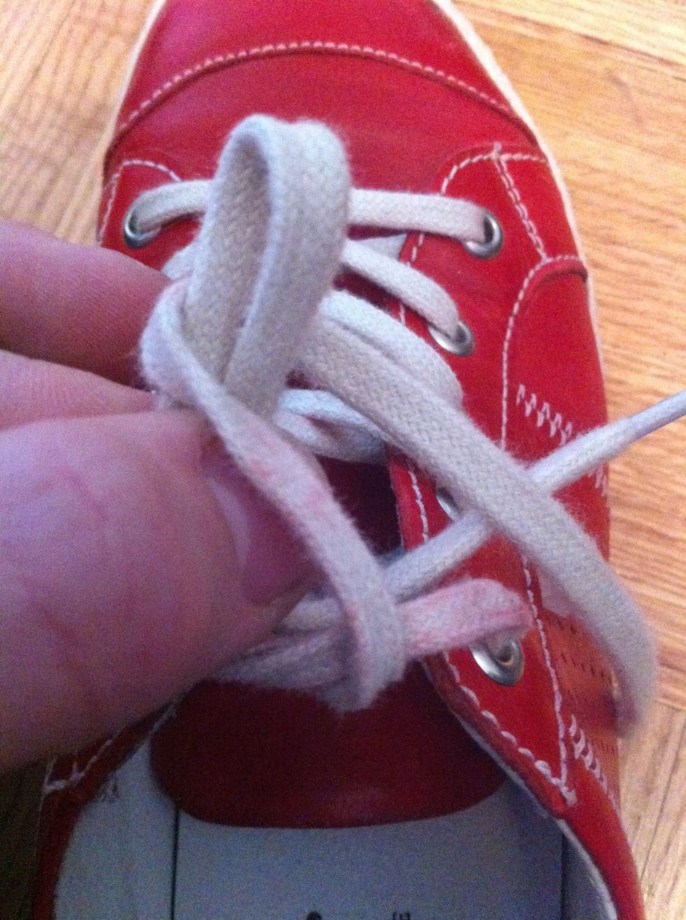 Now this time, go the OTHER way around the bow... Behind the bow (nearer to yourself) then around the frontside of the bow towards the toe of the shoe.