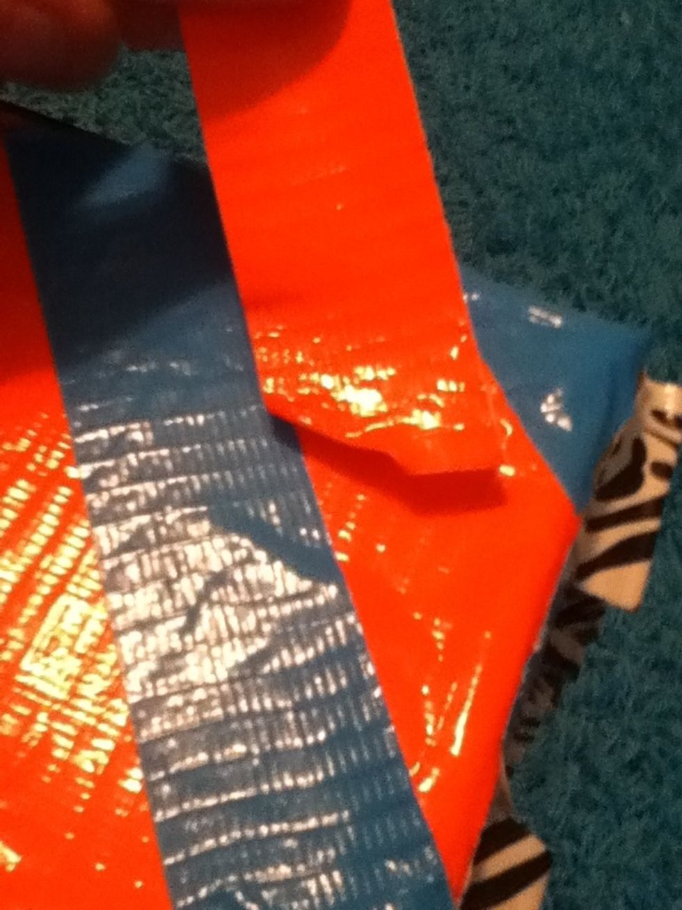 Now time for the fun (harder) part. First you need to make sure that the designs match the size of the other tape in your hand. If it doesn't make sure to cut it.