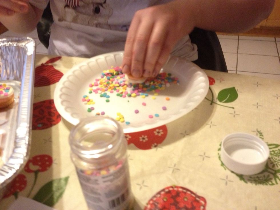 Now time to decorate even more! I used spring themed sprinkles, a pale rainbow color. Use amount of sprinkles at your discretion