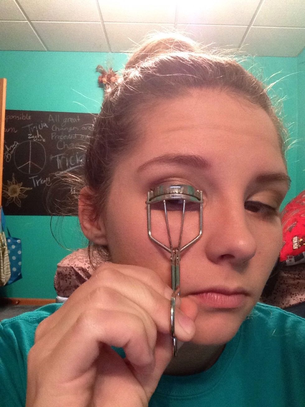 Now to curl the lashes! Be careful not to pinch your eyelid!!! Clamp the lashes for about 10 seconds to curl.