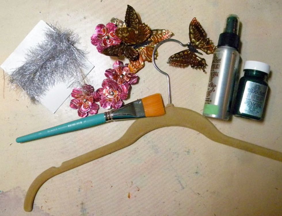 Now, to decorate the hanger. Paint it with Emerald Gemstones on both sides and let it dry.