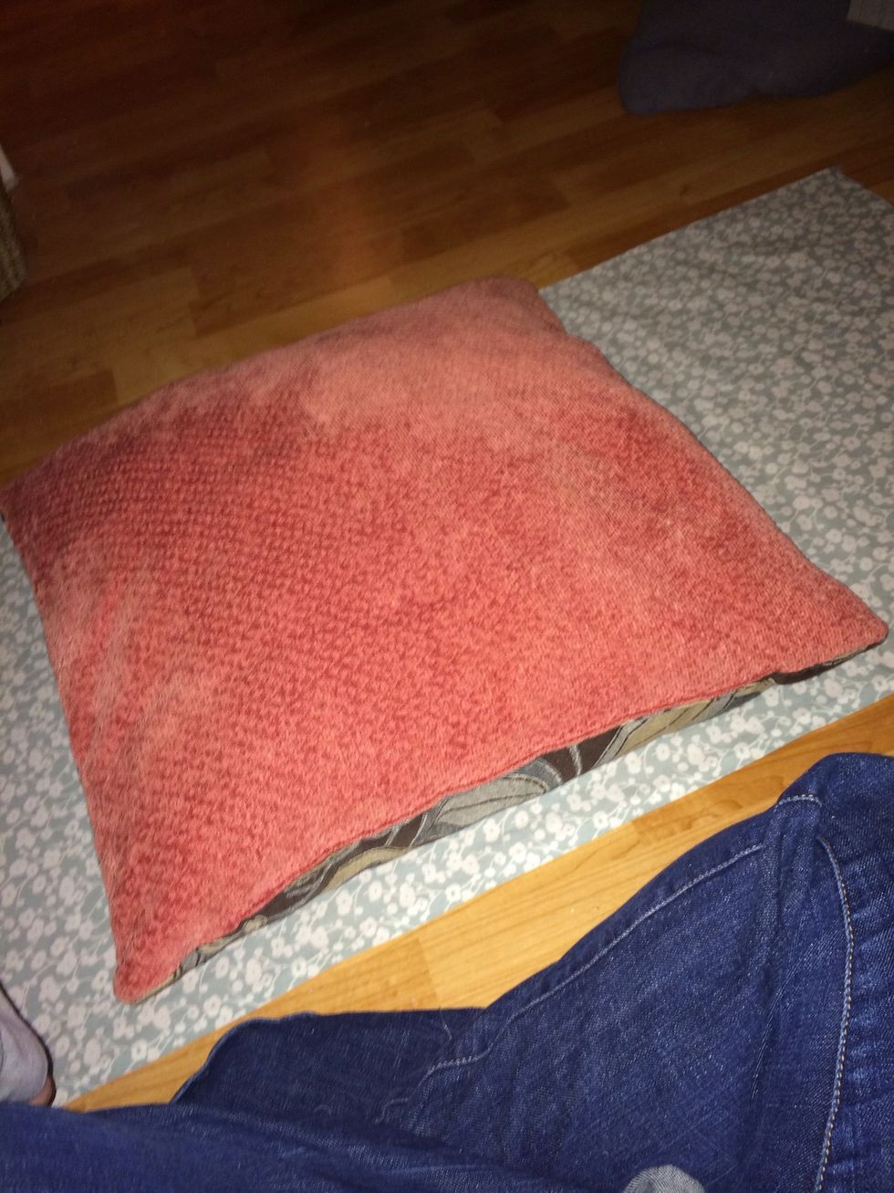 Now to eyeball the size of the cover (lazy person!!) place the pillow back on fabric and wrap it like a present inside out...