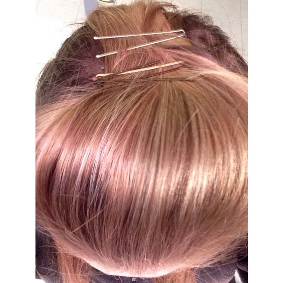 Now, to keep the poof secure, bobby pin it several times just behind the poof you have just made.