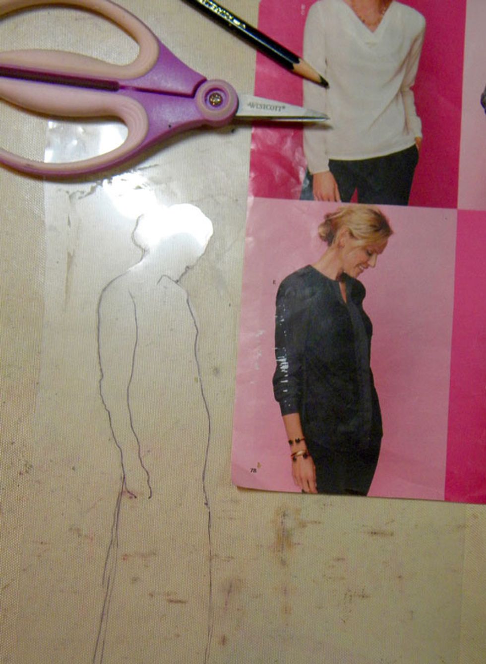 Now to make the silhouette stencil. Find a picture that you want to make the stencil from and lay the transparency on top of it and trace the outline of the figure. Carefully cut it out.