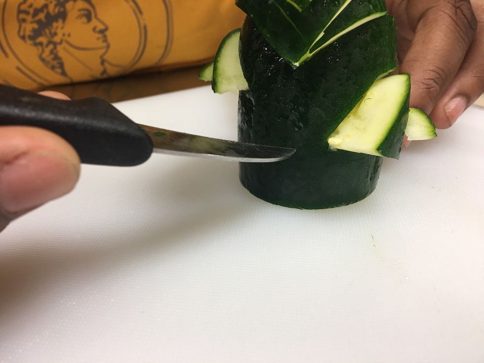 Now to make your TAIL. We are starting off with doing a tail hole. Go to the back of the swan and place your knife over the middle.