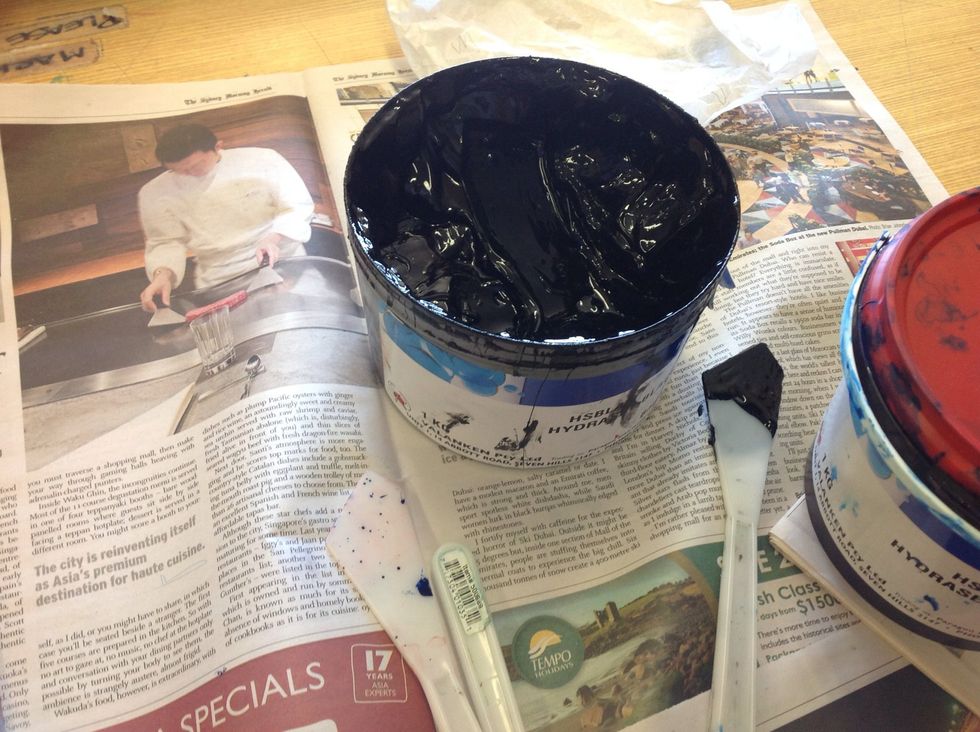 Now to print! Using a water based printing ink, plenty of newspaper to keep the tables clean and a palette knife to scoop out the ink.