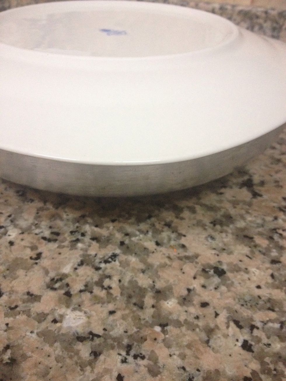 Now to serve, run a sharp knife around the edge of the pan... Cover with a serving plate, hold them tightly and invert