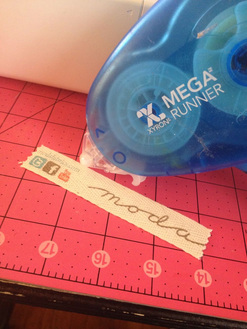 Now to sew on! I use a little bit of Xyron take runner down the center to hold the tape in place as I sew. You can also use fabric spray adhesive or fusible webbing