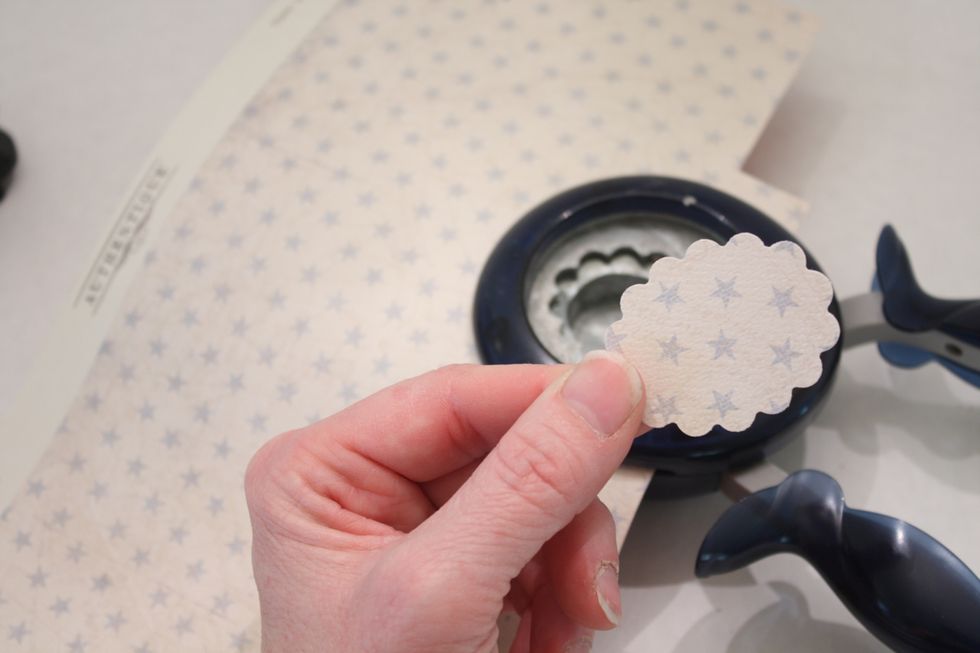 Now to stabilize your boat, punch out a small circle of paper for the base