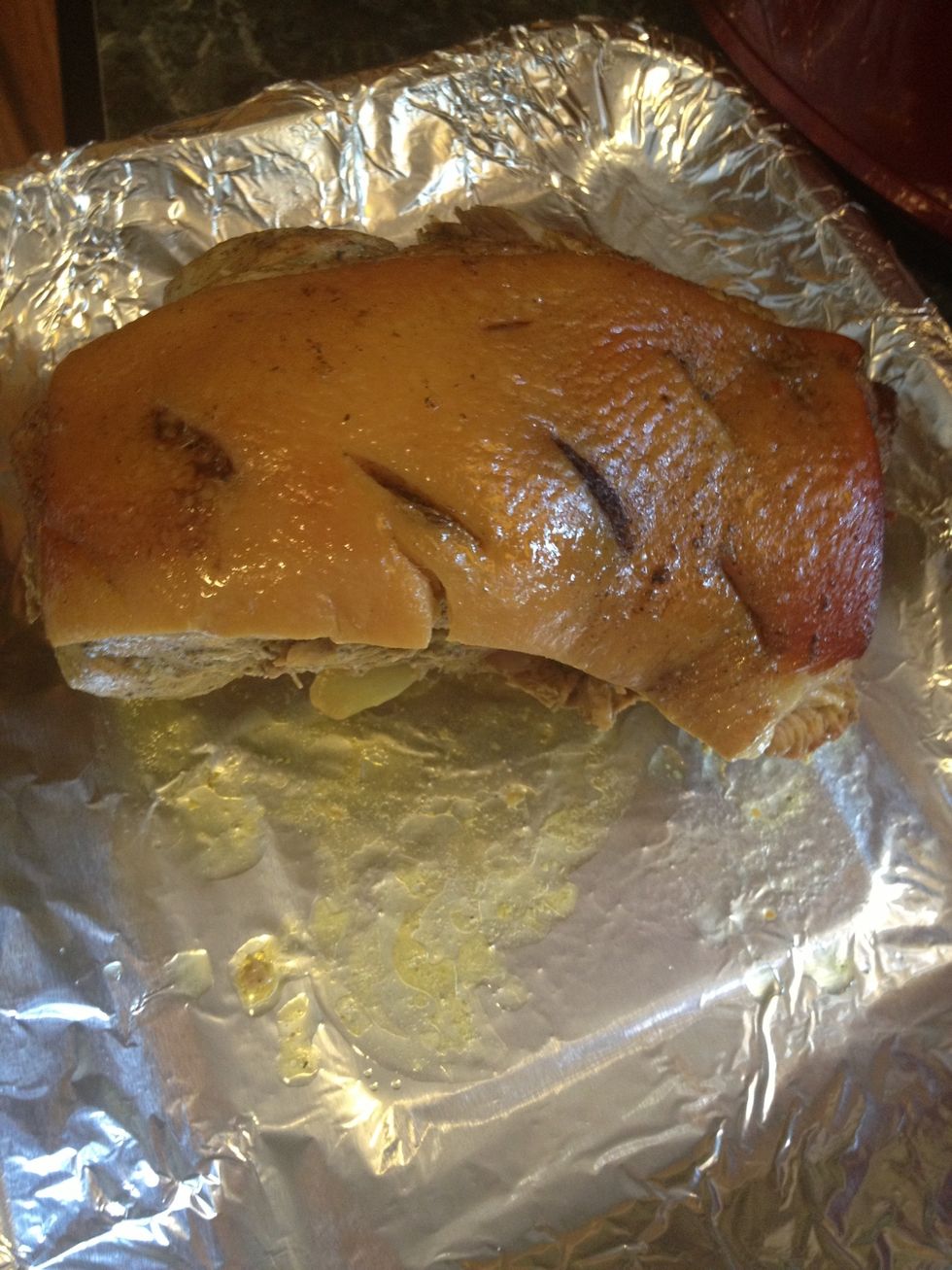 Now to the next step. Carefully you hear, I said carefully remove the pork from the slow cooker and place it on an oven proof plate we are popping him in an oven to get the skin crunchy.