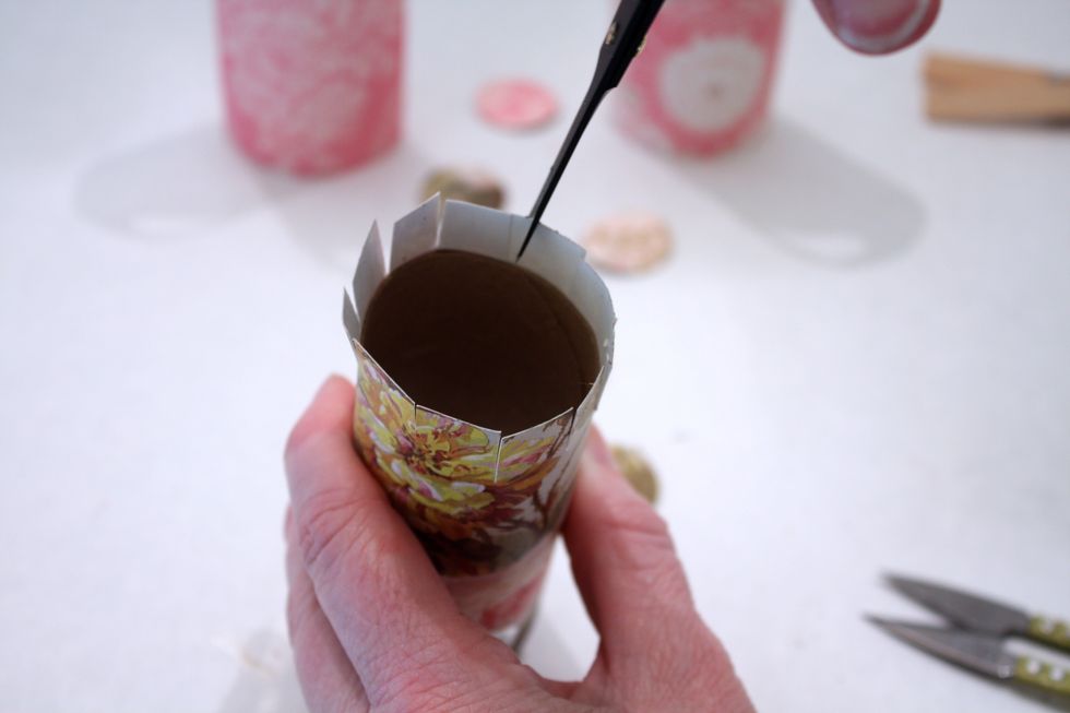 Now trim down at the base as shown- go ALL THE WAY to the tube so your basket lies flat