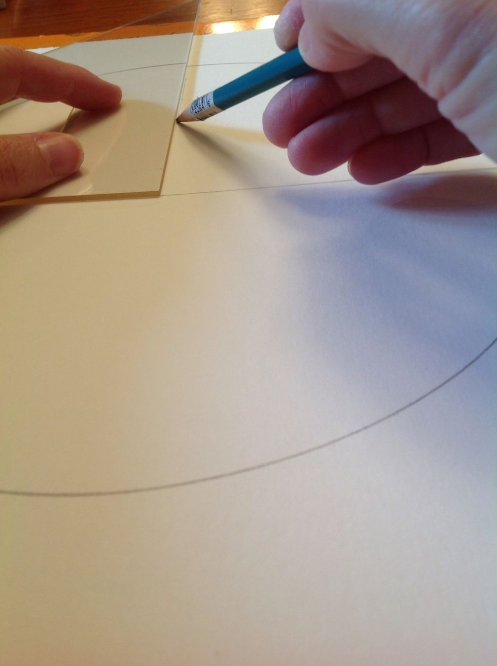 Now turn the circle a quarter turn and draw a line down the center again.