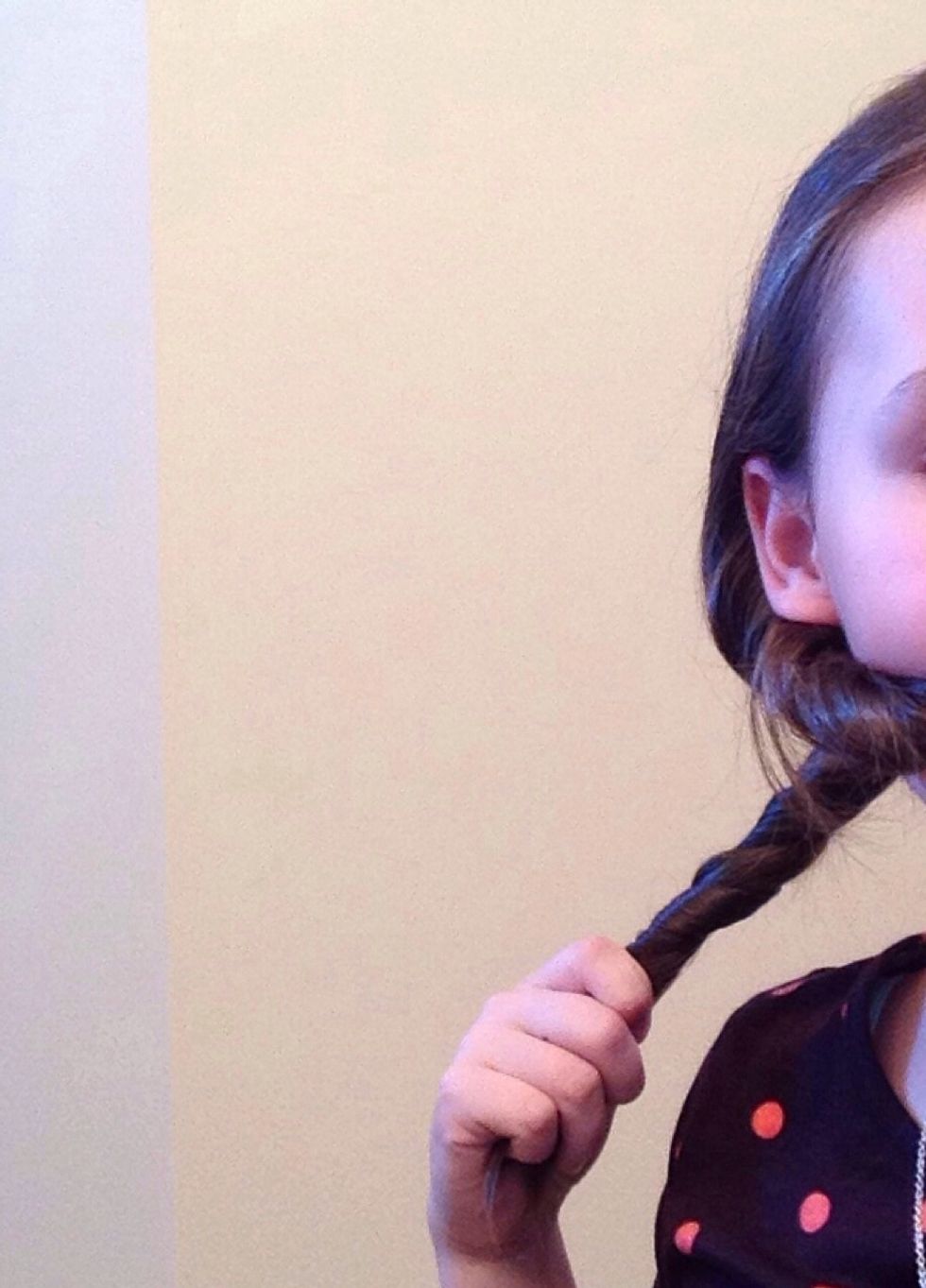 Now, twist each section. When you twist the second section you will have to put the first hair piece in your mouth to keep it in place.