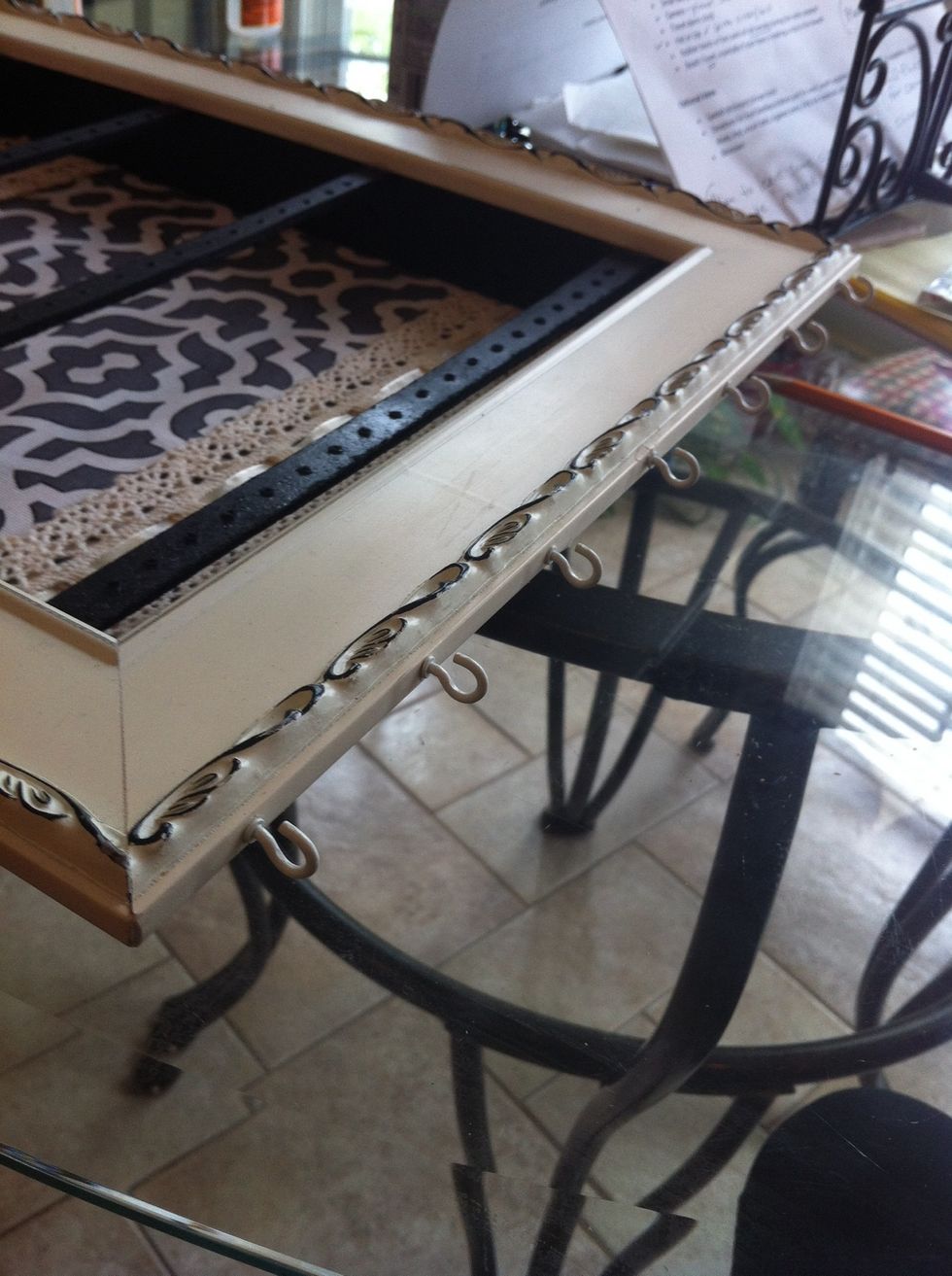 Now twist the hooks in the drilled holes and that's where the necklaces go!