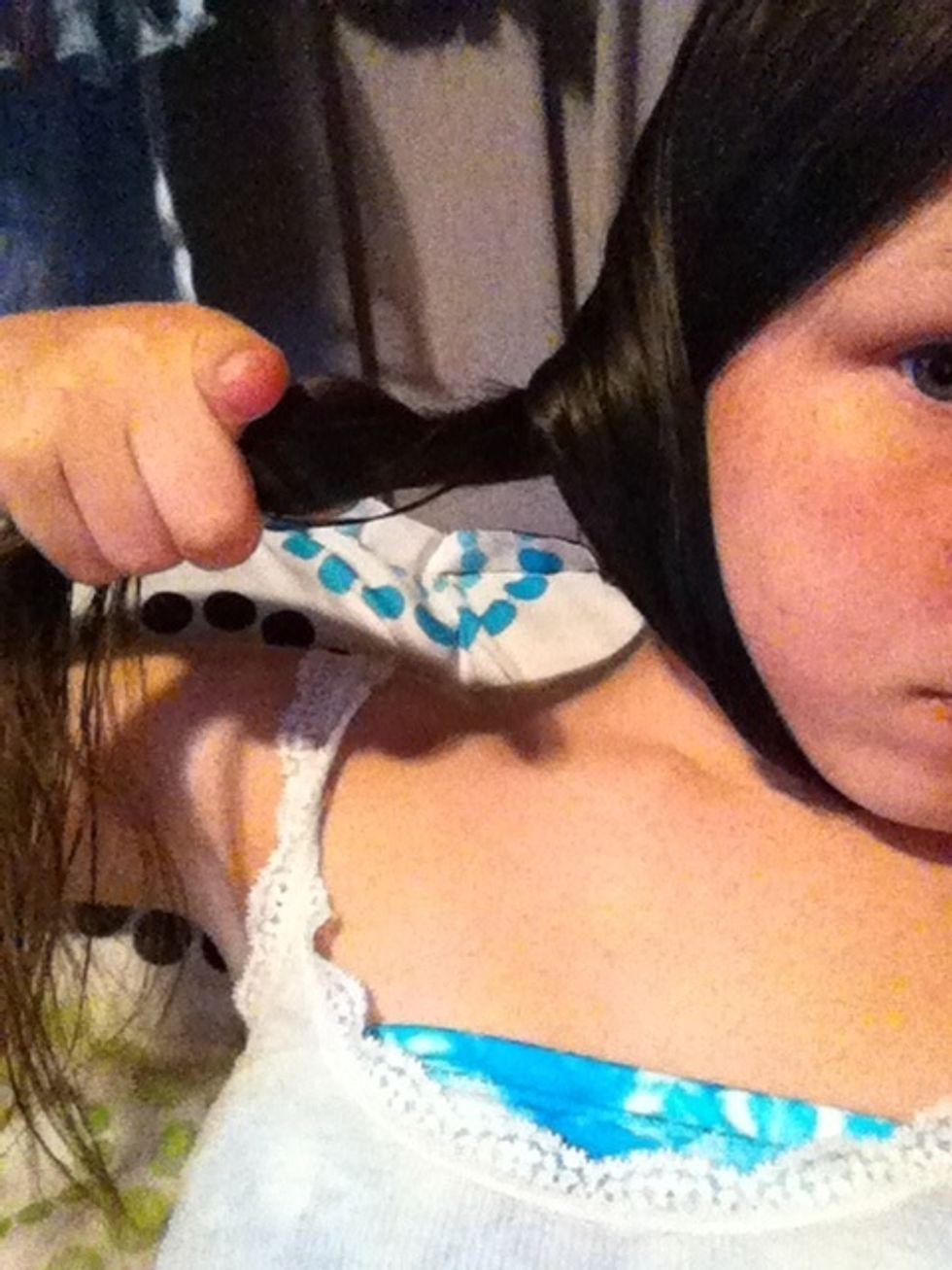 Now twist the piece that is now in the back towards the back of you.