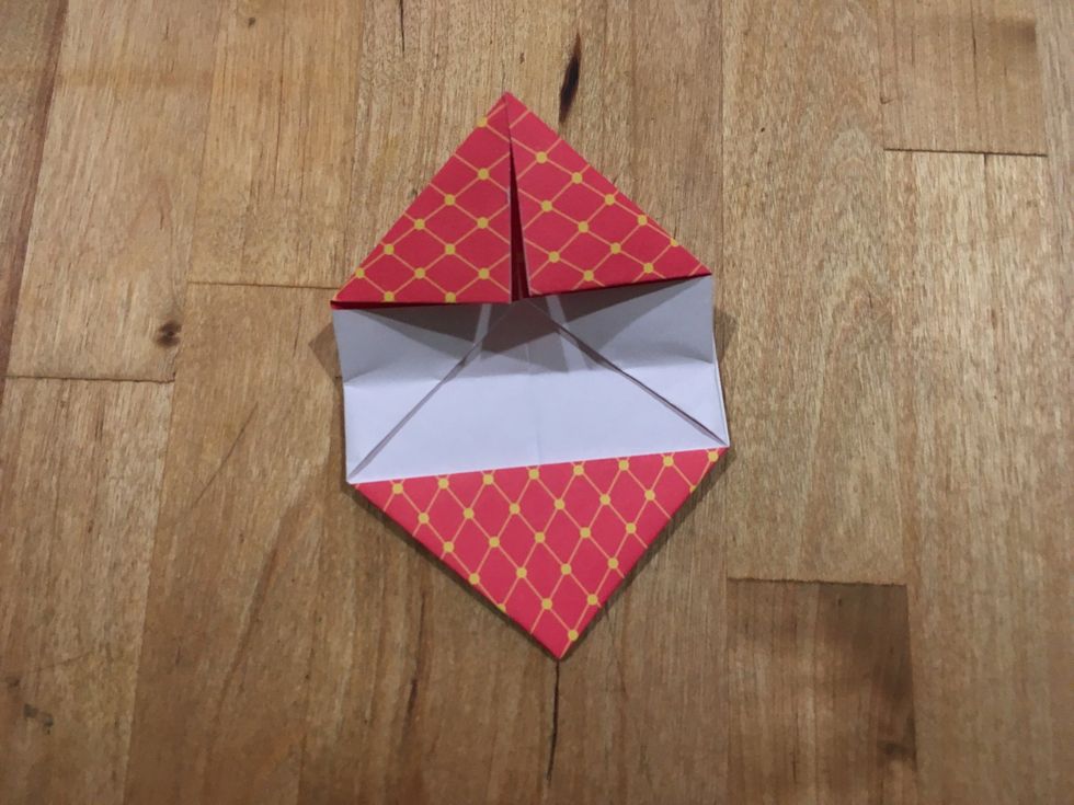 Now unfold it so it isn't in half now.