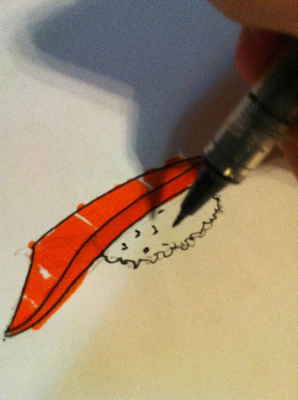 Now use a black marker to make a texture to a rice