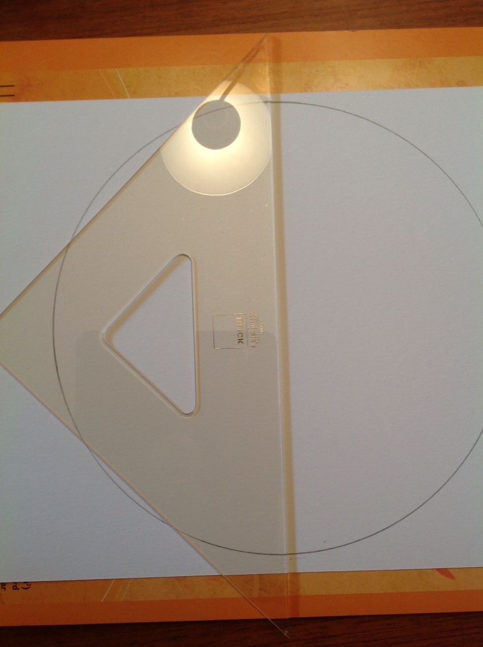Now use a straight edge and draw a line down the center of the circle.