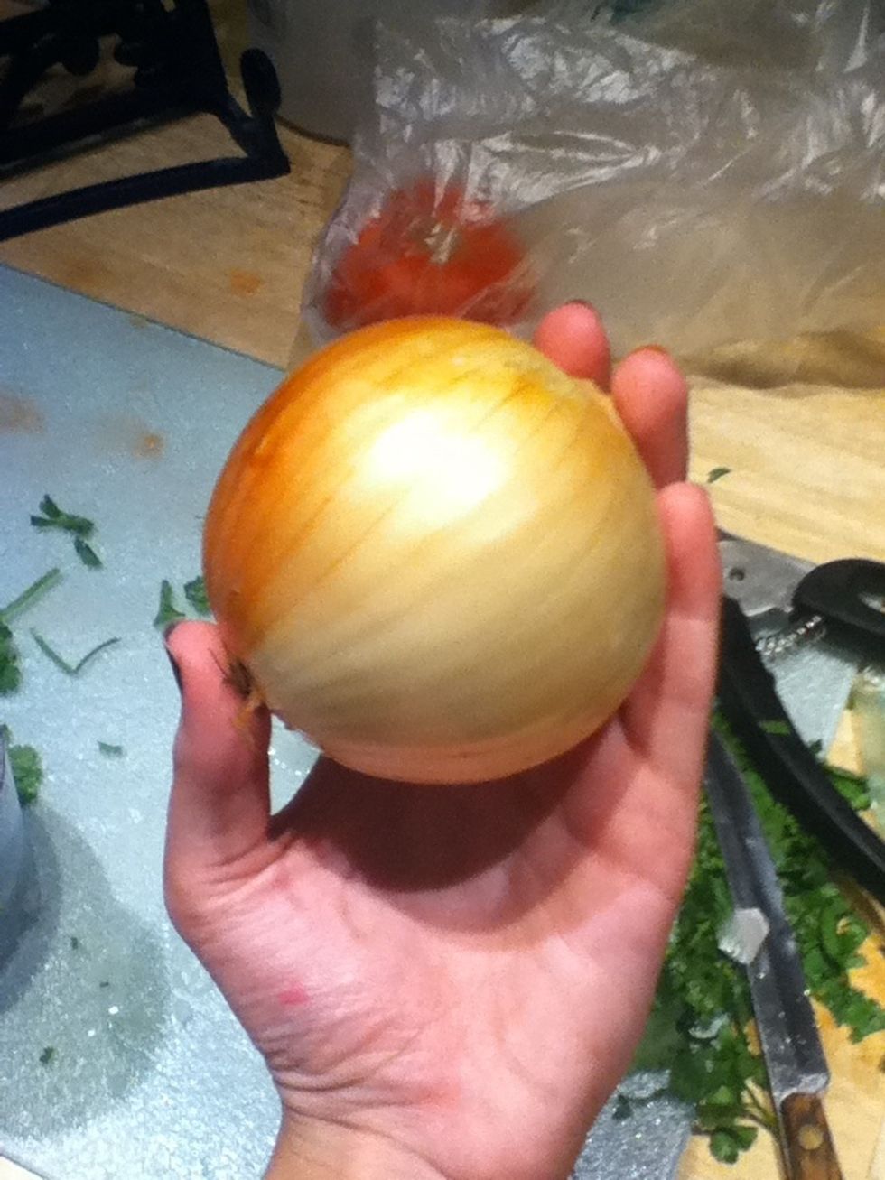 Now use about half of a yellow onion and finely chop.
