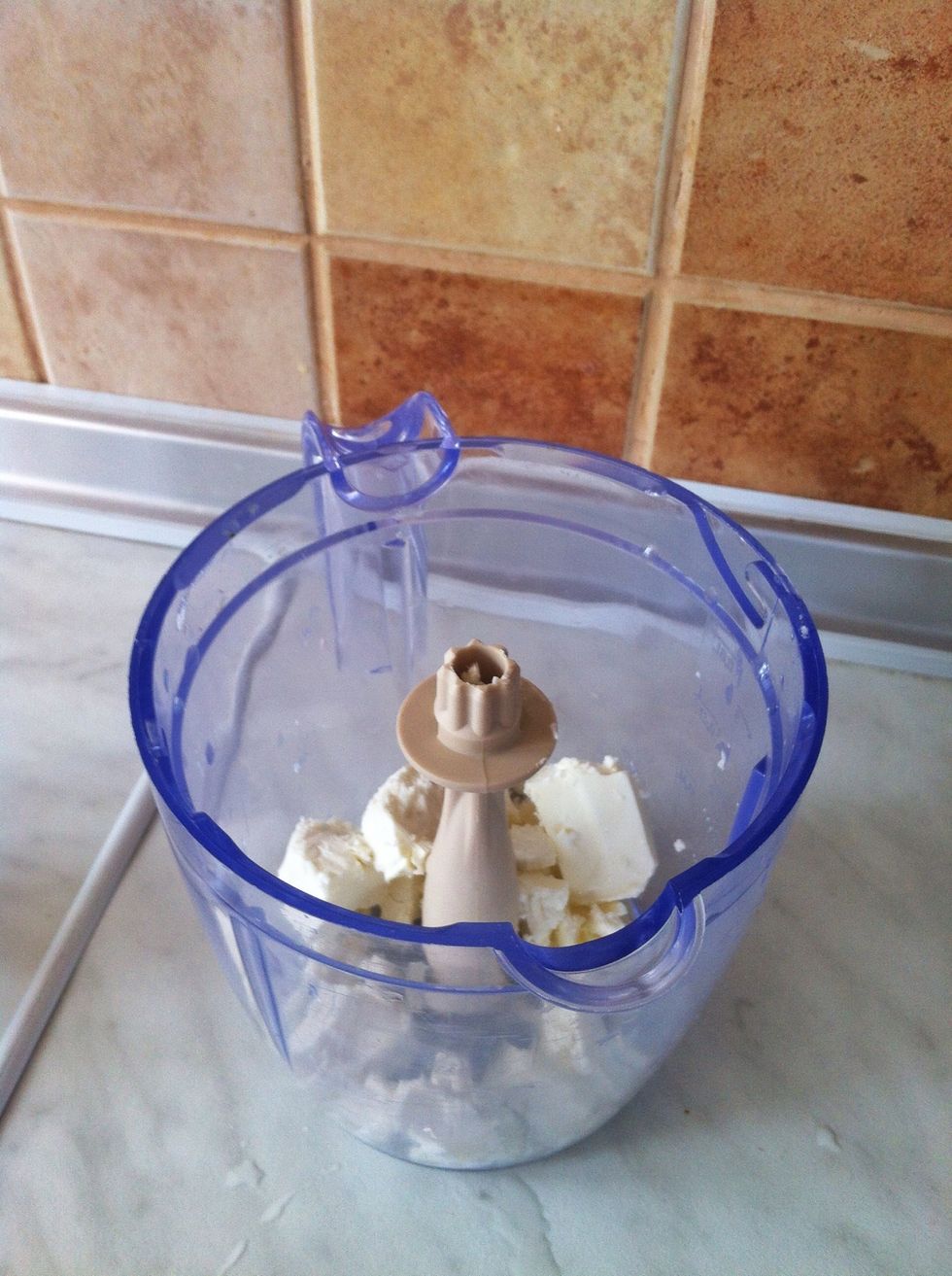 Now use blender. Take Feta cheese here and all herbs you've just cut. Also if you like, you should use some Garlic