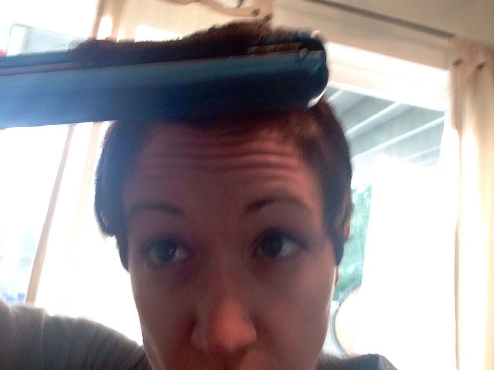 Now use straightener to curl all bangs together.