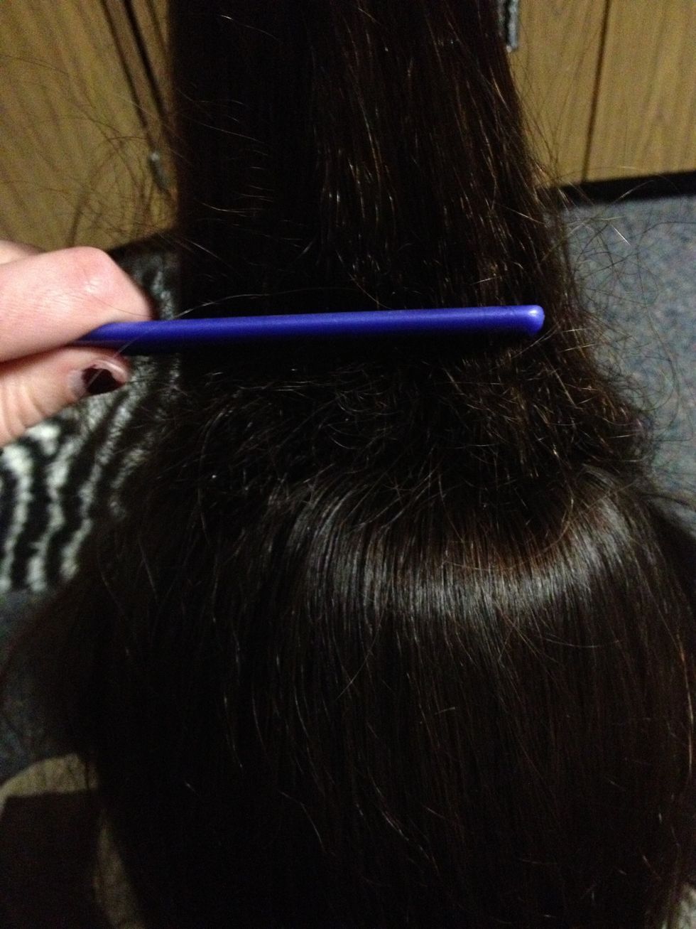Now use the comb and comb down on the hair! Do this as much as you can adding tangles! The more it looks like a bird nest the better! :)