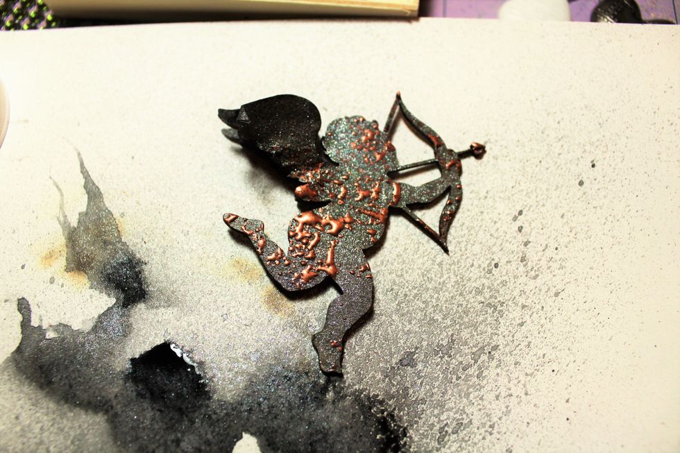 Now, use the embossing gun to melt the powder. I repeated this step again to get her to look like this.