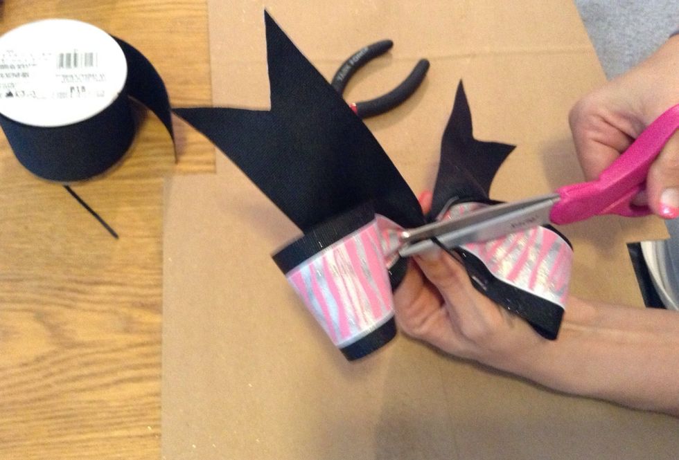 Now use the scissors to cut the excess zip tie off and discard.