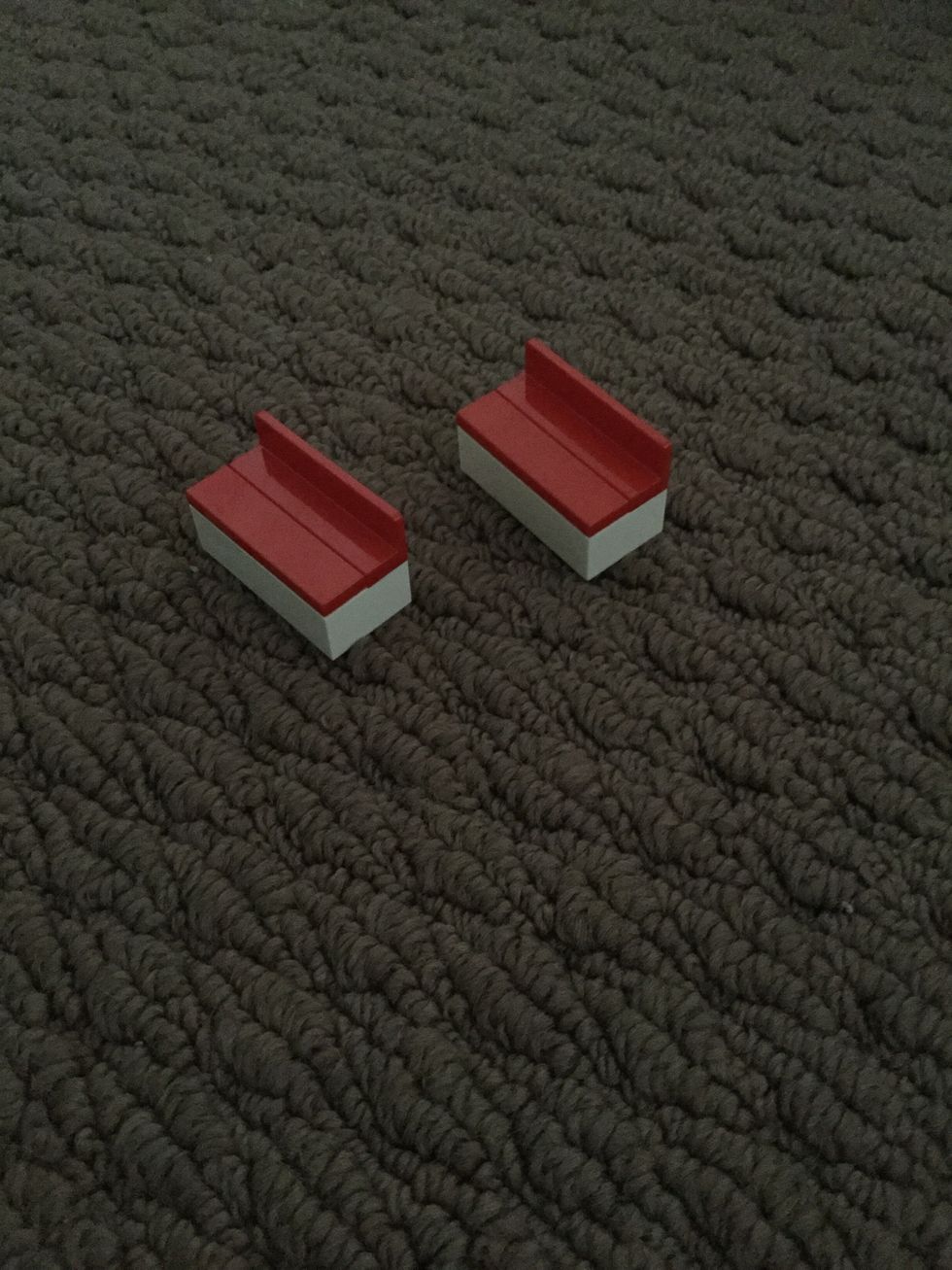 Now use the two flat red pieces to put in front of the curved red pieces.