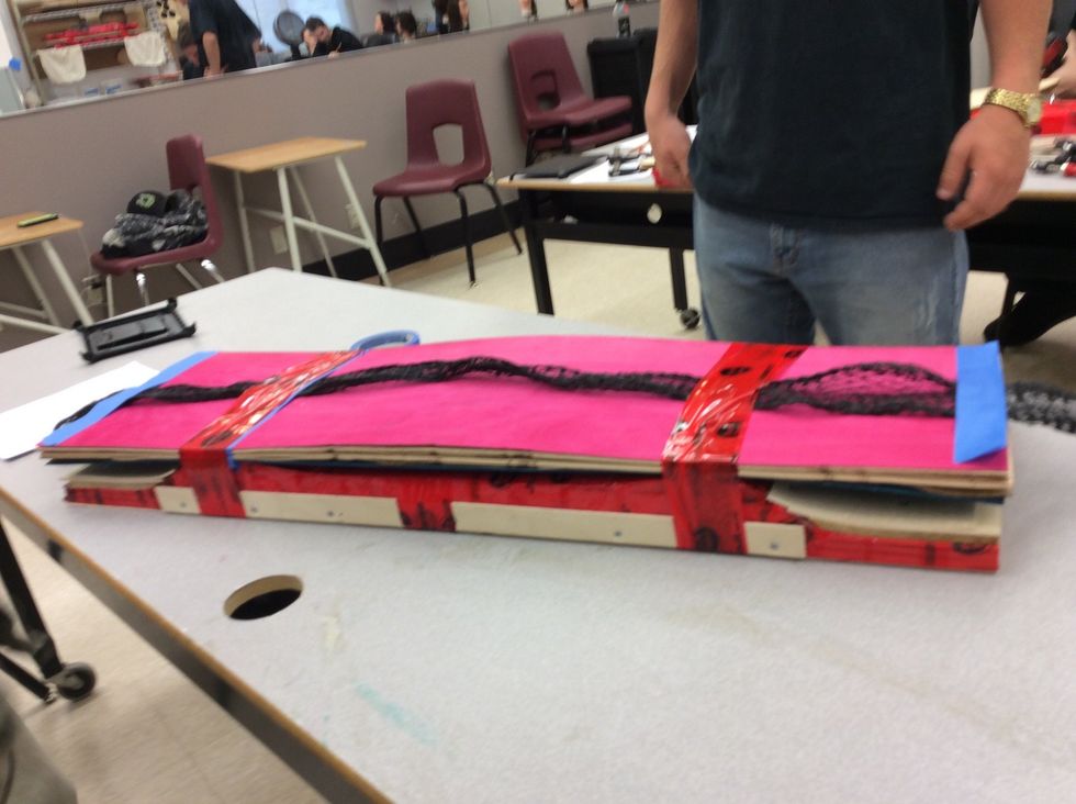 Now use TuckTape and wrap it twice tightly around the board.