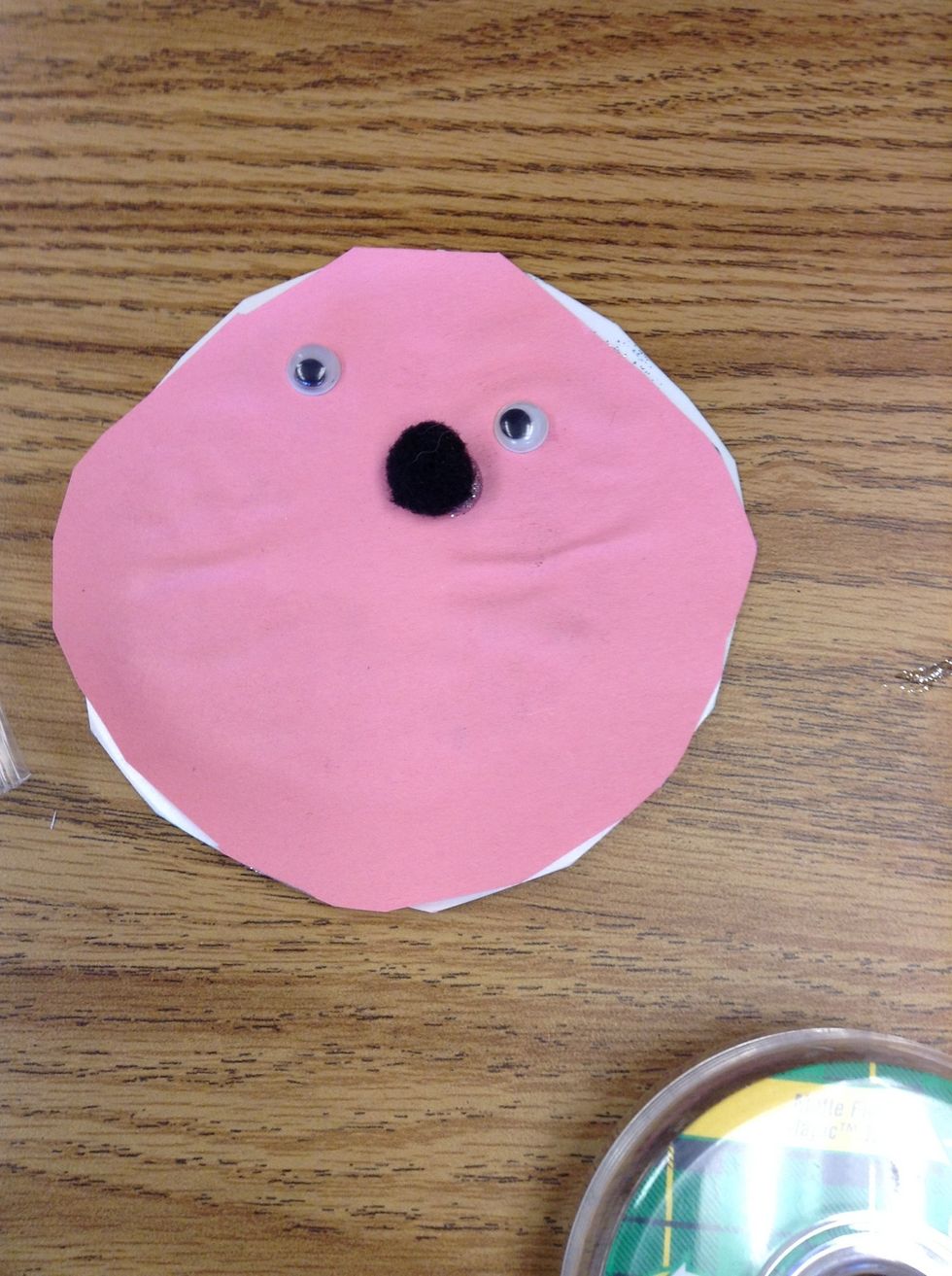 Now, use your Pom poms as the nose.