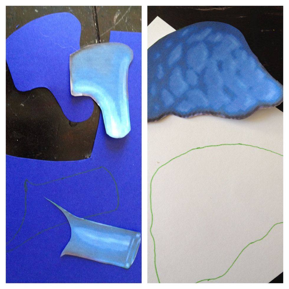now use your template to trace the different pieces of the heart onto the corresponding color of paper. I used dark blue, a blue peacock print, red, pink zebra print, and yellow snake print.
