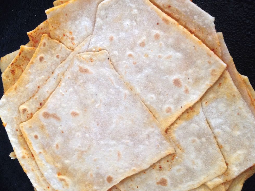 Now using a clean kitchen towel slight press the paratha and rotate it