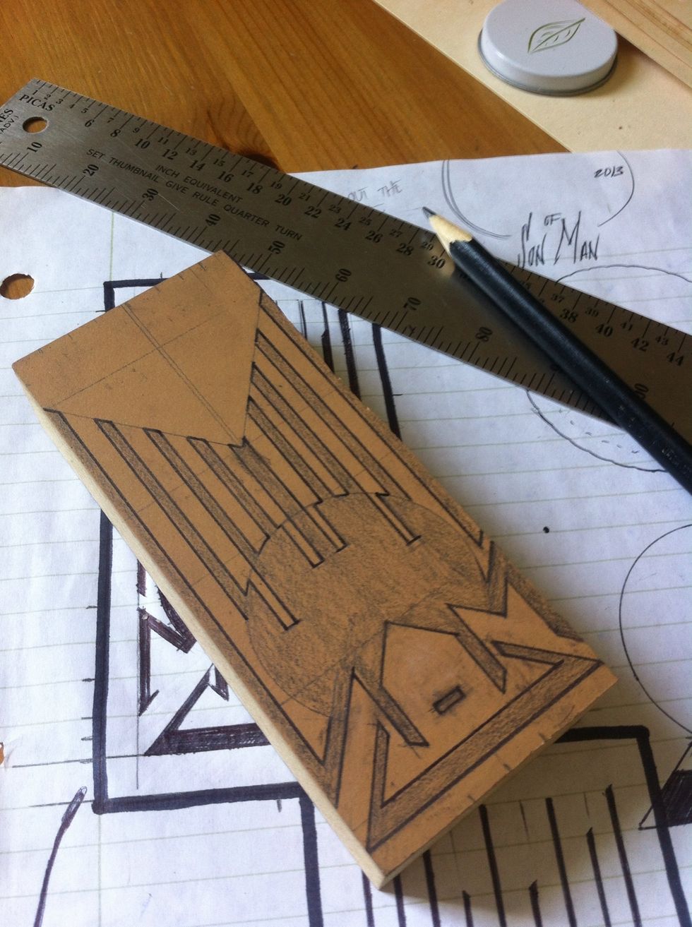 now using a fine tipped permanent marker, trace around your design.