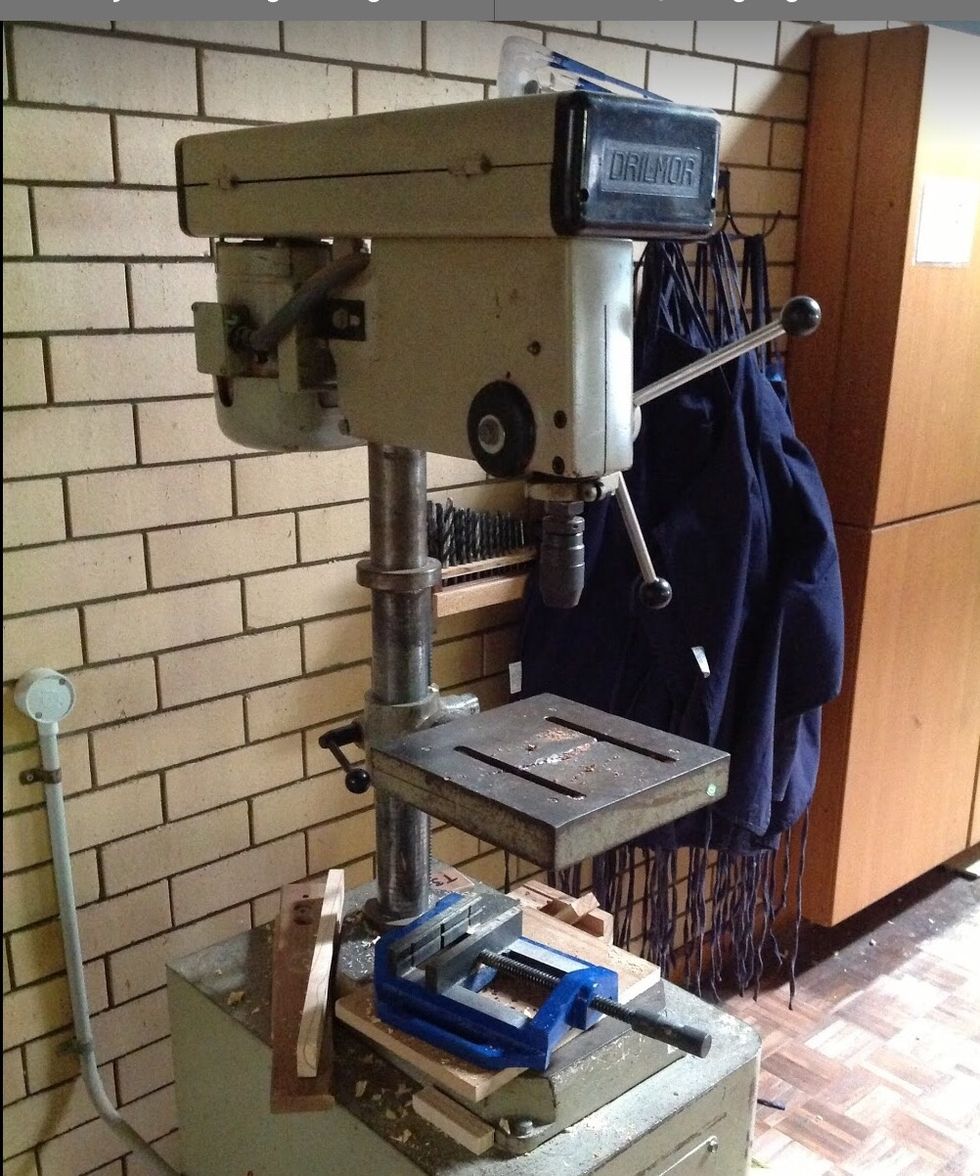 Now using your drill press, get your scroll and your feet and separately begin to drill through.