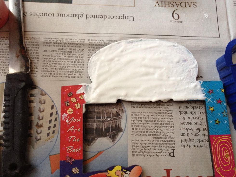 Now using your hand start applying the zinc oxide-glue paste to the surface off the frame.