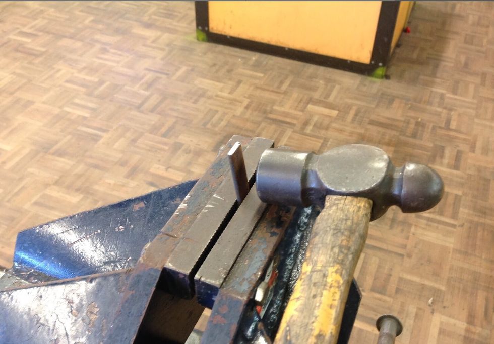 Now using your scribe and ruler, measure out 1.5 cm on both ends. Once you have done this place your feet into the vice and using your ballpein hammer begin to hammer the ends.