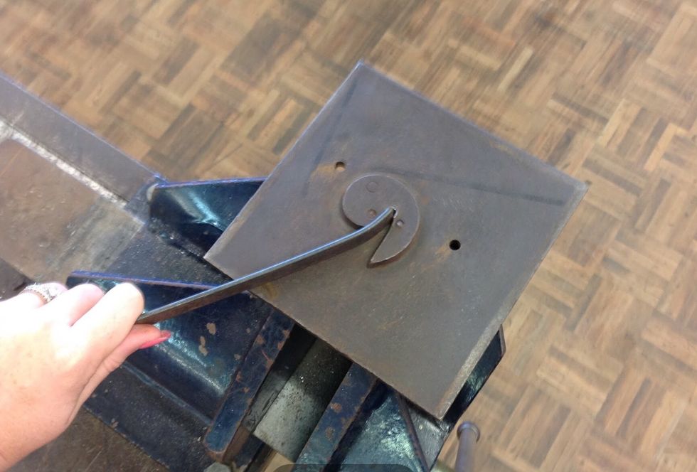 Now using your scroll plate, place your flat bar in the scroll plate