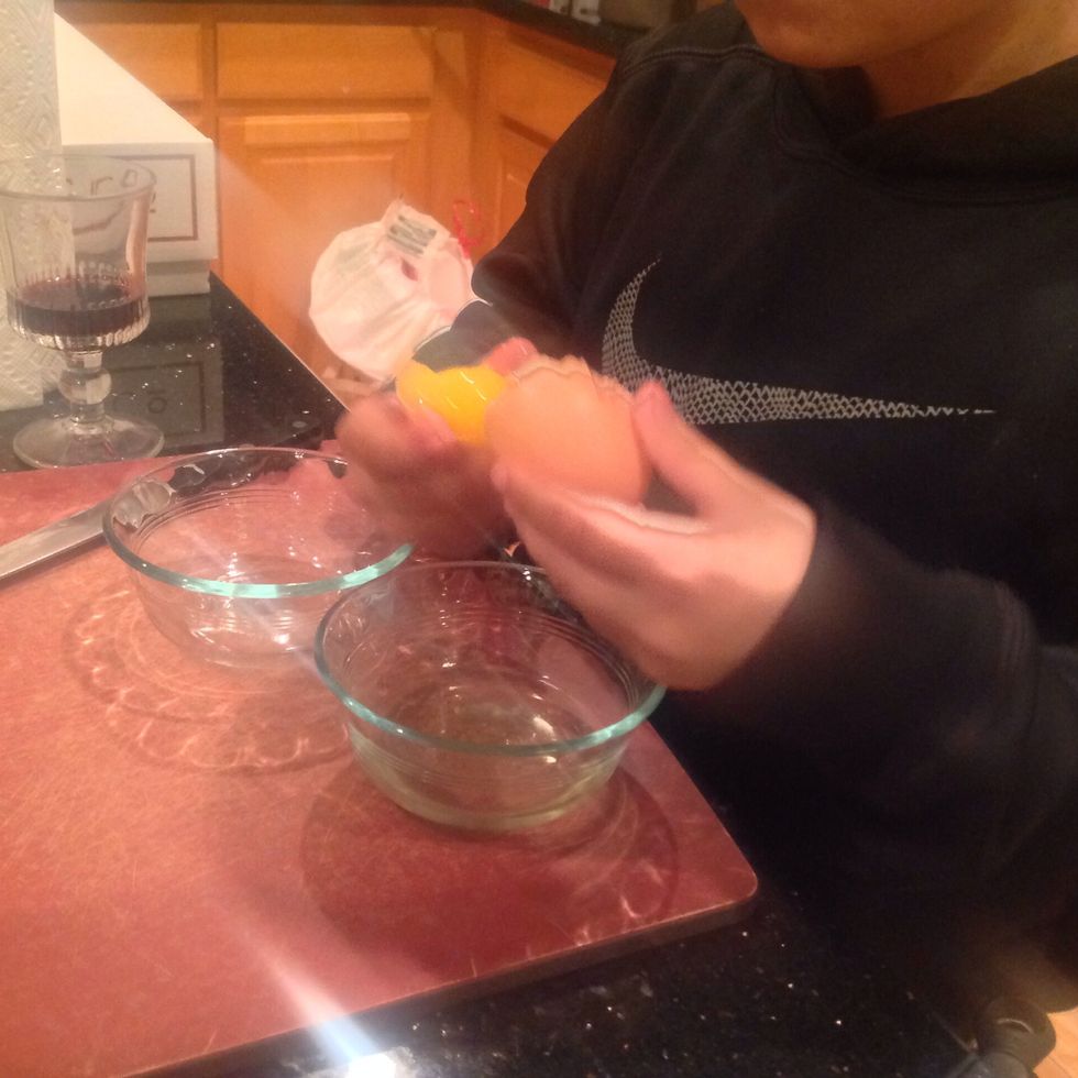 Now very carefully separate eggs by slowly scooping under and transfer the hold from shell half, and let the egg white fall under