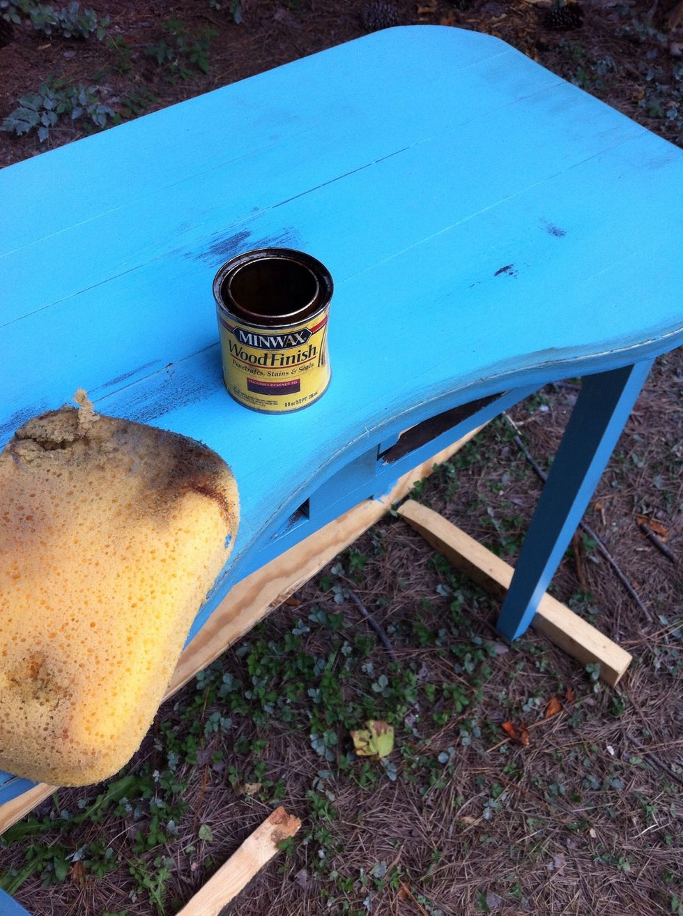 Now very lightly dip a sponge or rag in a tiny bit of wood stain and rub it on the places u sanded and around the edges of the furniture and in any cracks u might see...then wipe it off..