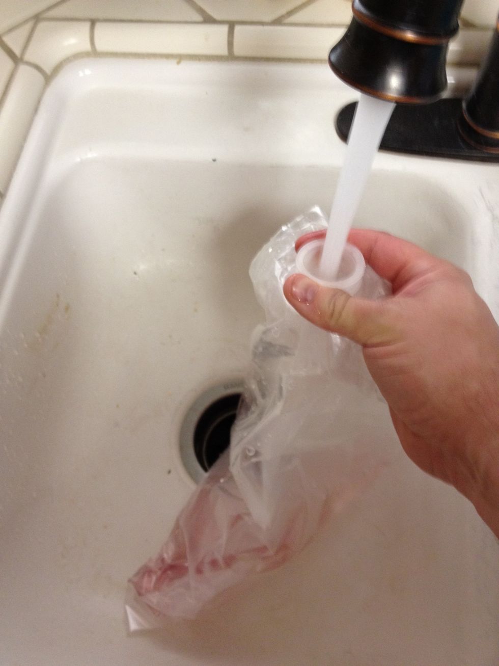 Now wash out the small amount of wine remaining in the bag.