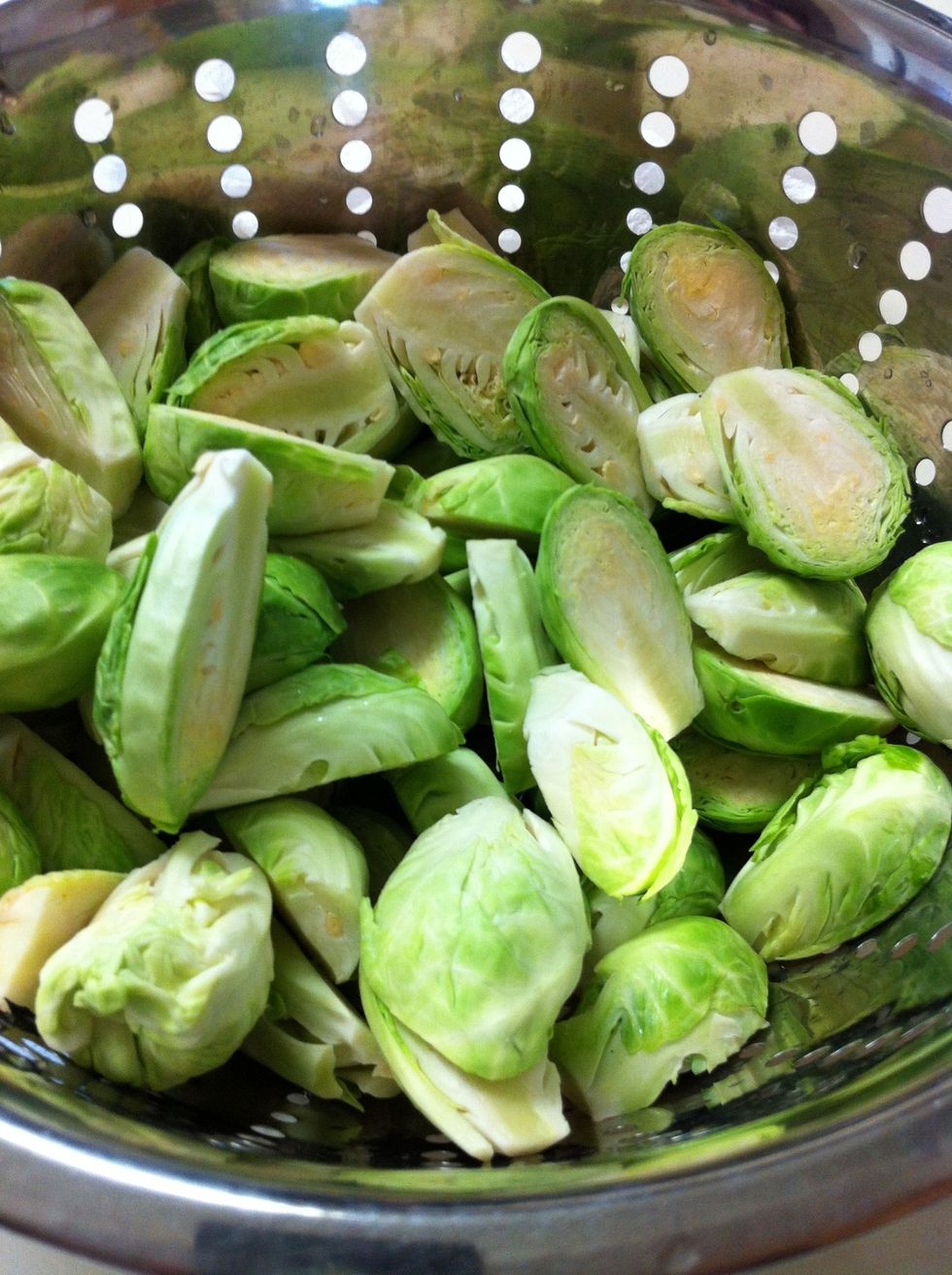 Now wash the sprout halves under cold running water. Using a pasta strainer makes this real easy.