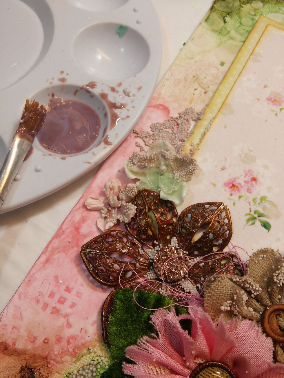 Now water down some Copper Metal Effects and panit over the Art Stones, and use a paint brush to flick some paint throughout the canvas.