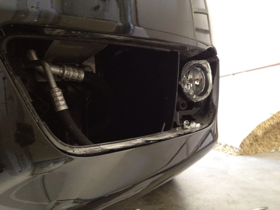 Now we are able to see where the fog light is housed and can remove it from here.