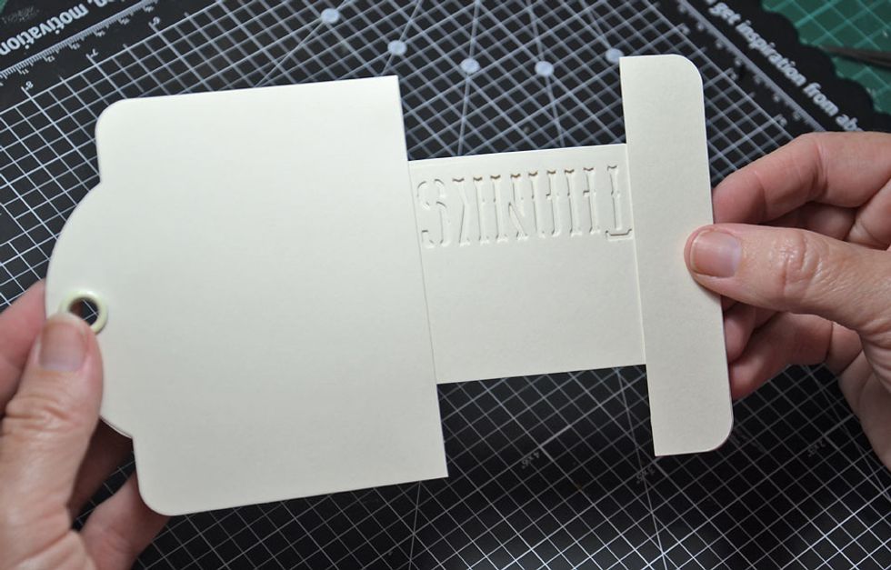 Now we are ready to slide the tag inside the top of the card.