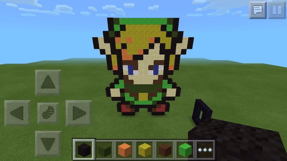 Now, WE FINALLY MAKE THE HAT! On top of the last black, put another, then a dark green, then eight light greens, then a dark green then a black.