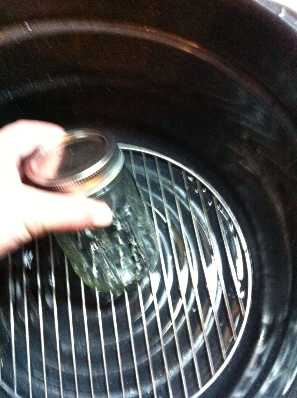 Now we have to sterilize so there's no microorganisms. Place your lidded jar in the pot.