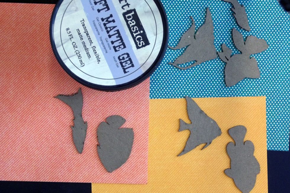 Now we'll alter the Creative Embellishments chipboard to decorate the bottle! Use Soft Matte Gel to glue the Tropical Fish to 6x6 paper - remember to glue on the reverse of the side you want showing!